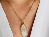 Beautiful 18K gold plated chain and raw moonstone pendant necklace exquisitely designed with passion.   Product Details  Composition: Raw Moonstone, 18k gold-plated brass Handmade in Morocco Please note the possibility of natural inclusions in gemstones