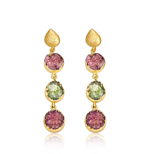 These eye-catching drop earrings will bring a burst of color and life into your jewelry collection. Each drop earring features jade stones in 22k gold brass detailing.  Measure 3 inches long Composition: 22k gold-plated brass, jade Handmade in Morocco Please note the possibility of natural inclusions in gemstones