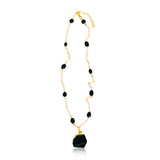 A beautiful hand made necklace. This gold plated pendant necklace for women comes with pearls and black onyx.  Product Details  Composition: 22k gold-plated brass, onyx, fresh water pearls 18 inches with 3 inch extender  Handmade in Morocco Please note the possibility of natural inclusions in gemstones