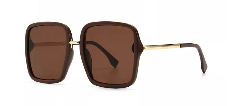 These stunning sunglasses will surely elevate any look. Trend aligned oversize design and iconic.  Frame Shape: Square Frame Type: Full Rim Eye/Bridge/Temple: 60/18/145 Lens features: Resin, dark brown UV400