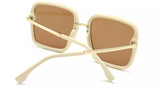 These stunning sunglasses will surely elevate any look. Trend aligned oversize design and iconic.  Frame Shape: Square Frame Type: Full Rim Eye/Bridge/Temple: 60/18/145 Lens features: Resin, Brown, 